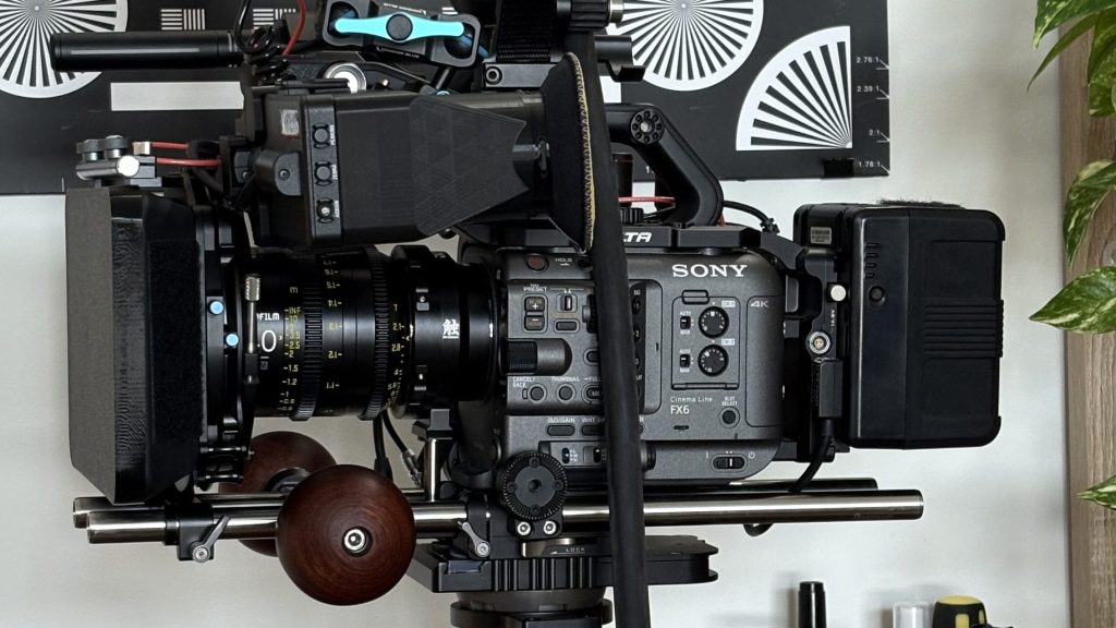 Handmade wooden ball camera handle attached to a cinema camera rig via ARRI rosette